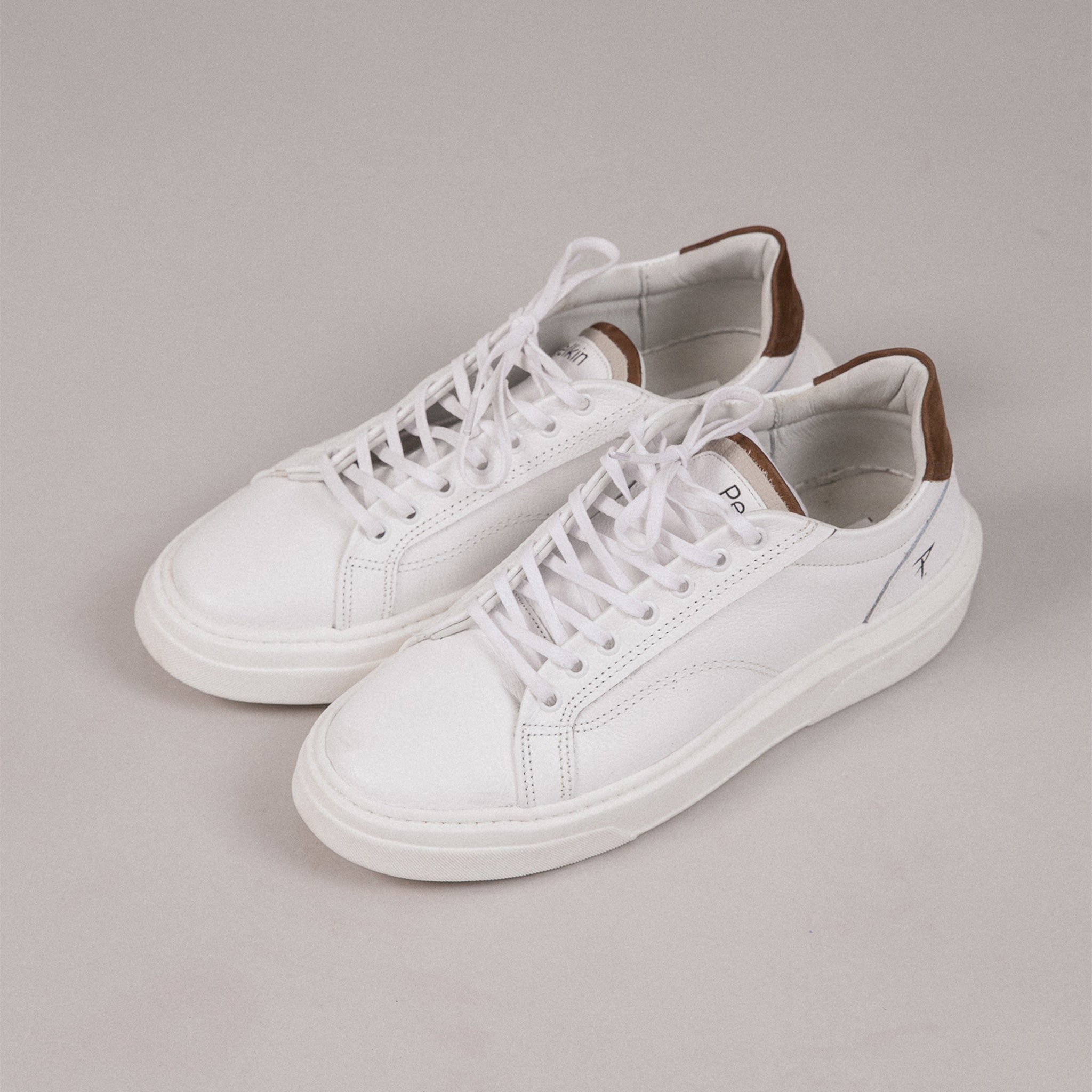 Queen Over White Trainers